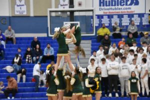 Cheerleaders perform holiday routine