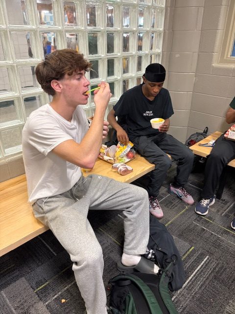 Senior Alex Baugh eats lunch during PowerHour